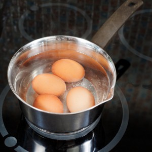 hen eggs are cooked in metal pot