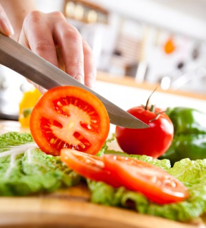 Woman's hands cutting vegetables